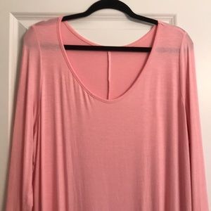 Asymmetrical pink tunic.